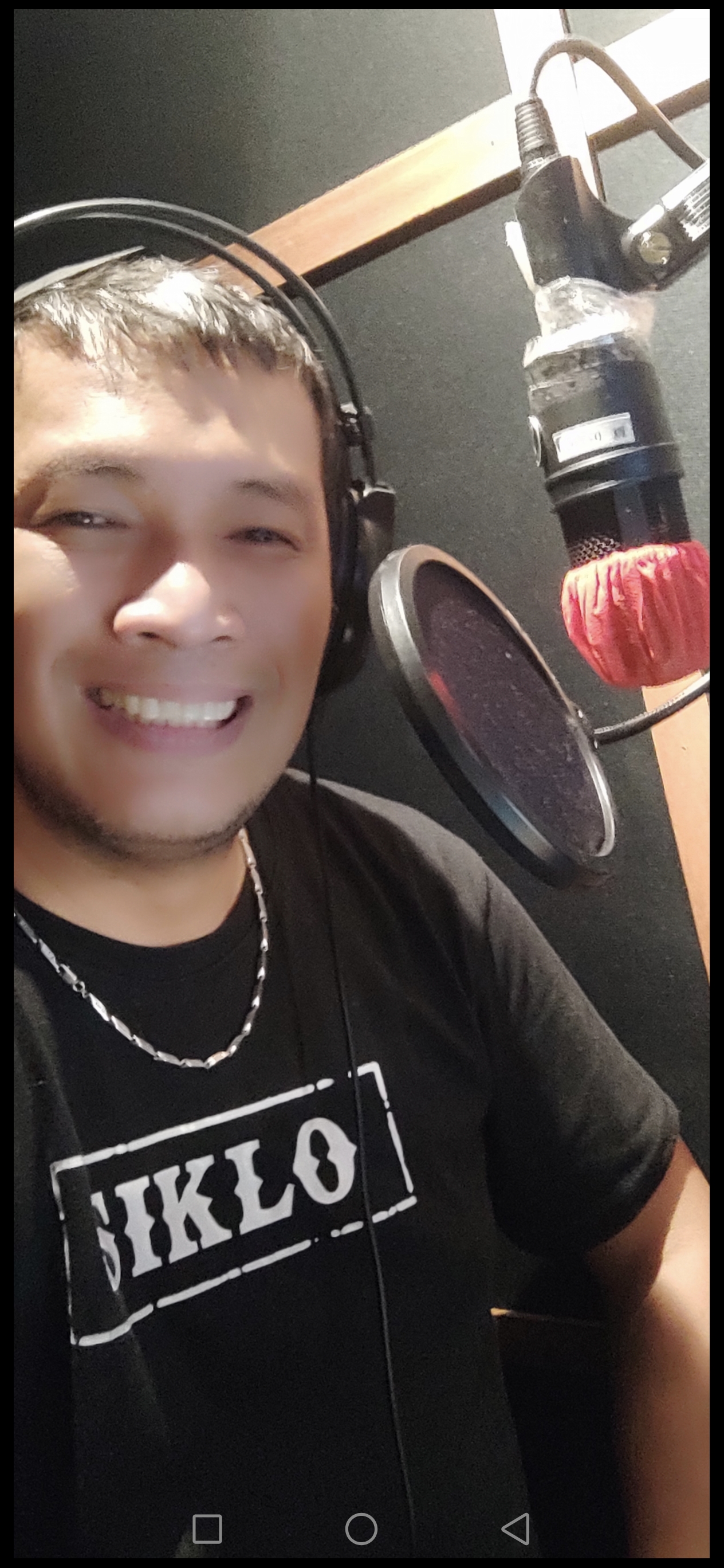 Noel Urbano recording in the dubbing booth