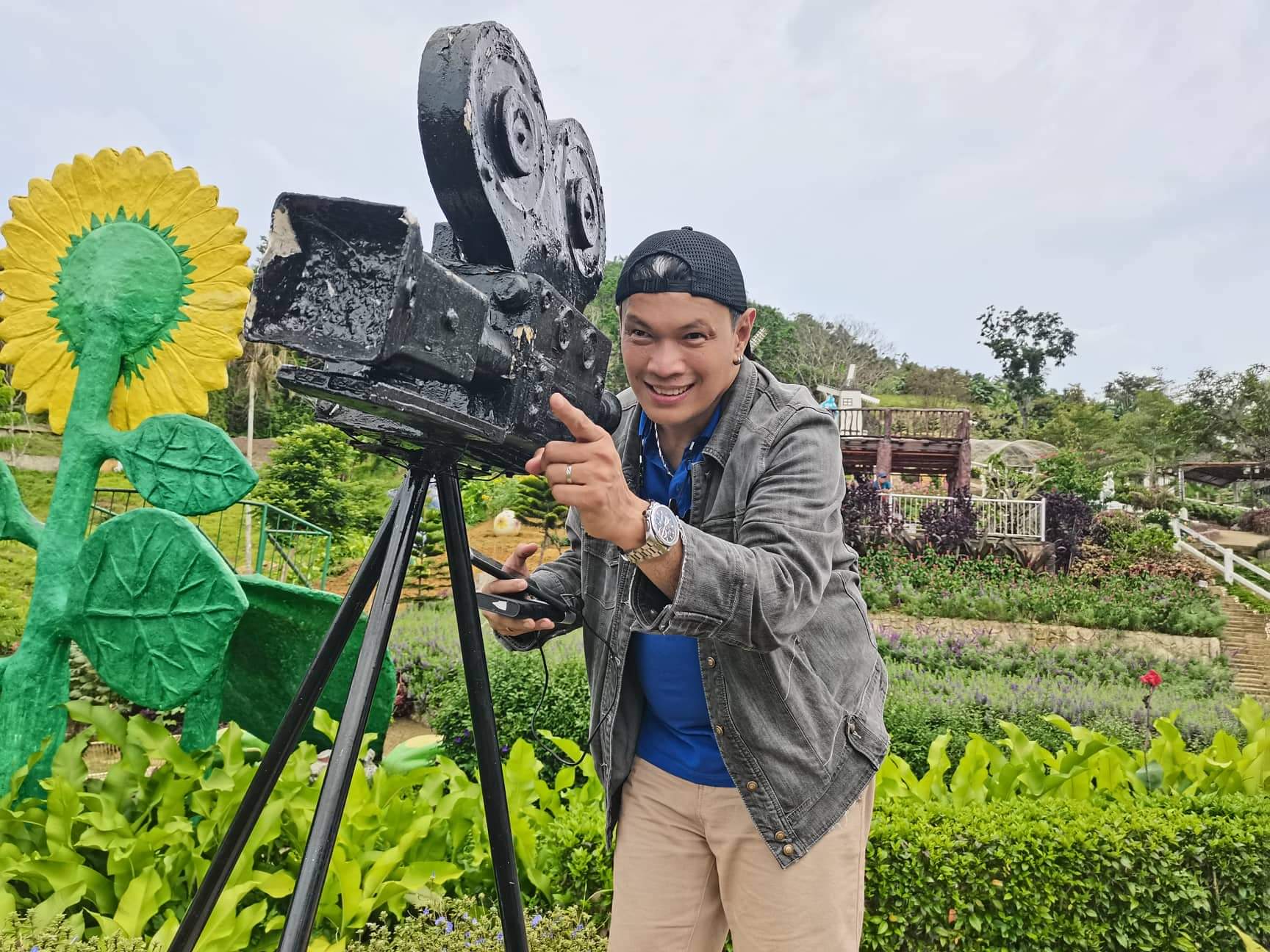 Noel Urbano with a vintage film camera prop